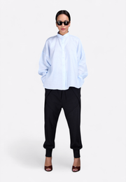 Model wearing classic long-sleeved light blue shirt, front view – East Vibe